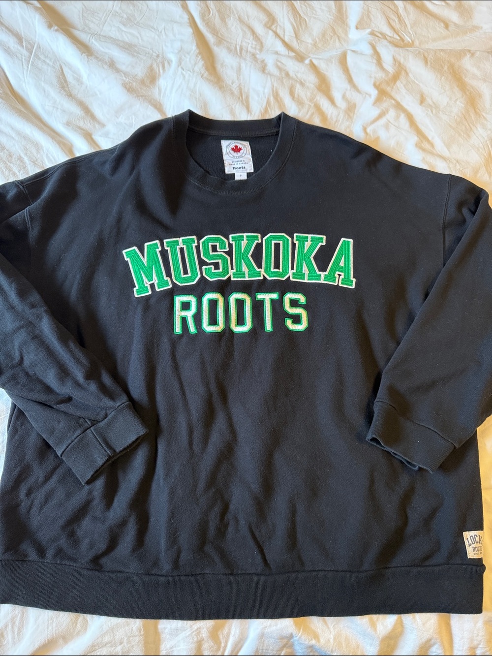 Roots Black Crewneck Sweatshirt with Green MUSKOKA Lettering